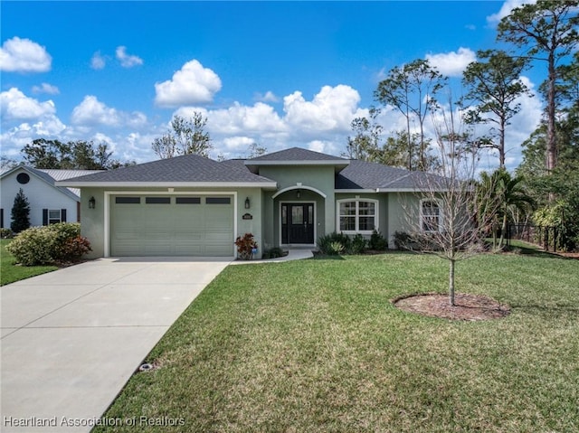 view of front facade with a garage and a front lawn