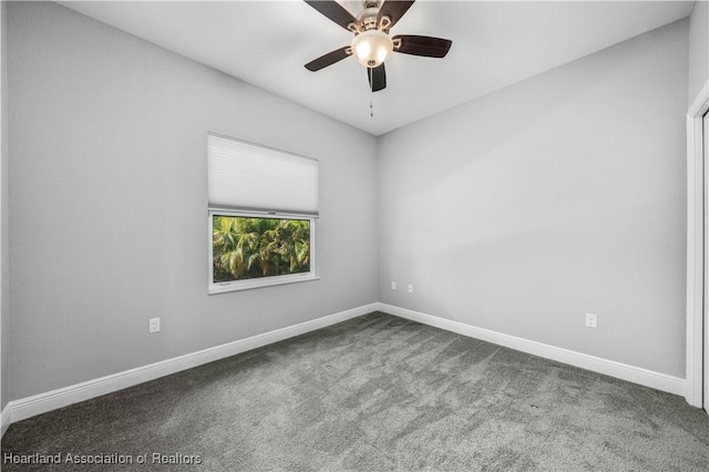 empty room with ceiling fan and carpet flooring