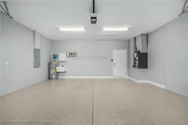 garage featuring sink, electric water heater, heating unit, and electric panel