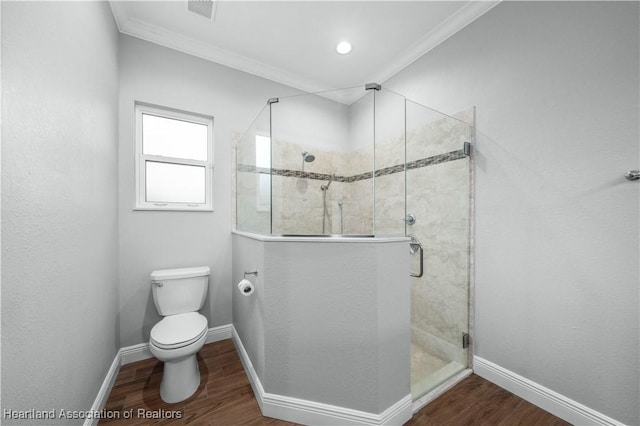 bathroom with walk in shower, ornamental molding, and wood-type flooring