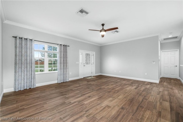 spare room featuring dark hardwood / wood-style flooring, crown molding, and ceiling fan