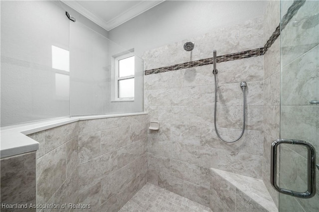 bathroom featuring crown molding and an enclosed shower