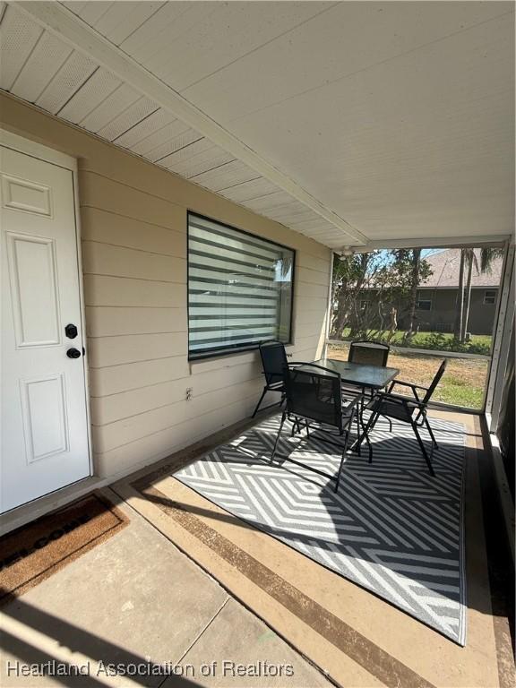 4350 Lakeview Dr, Sebring, FL 33870 - sunroom / solarium with outdoor dining space