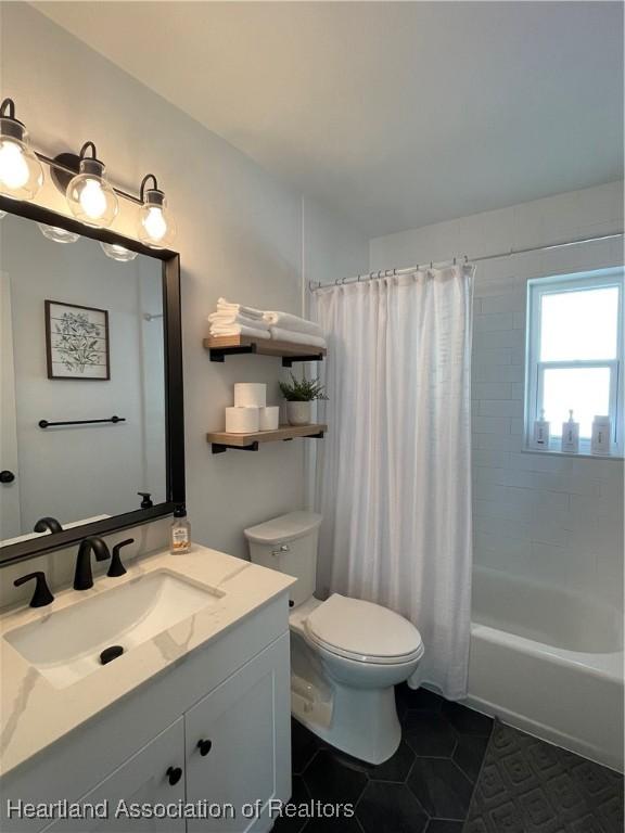 4350 Lakeview Dr, Sebring, FL 33870 - full bathroom with toilet, tile patterned floors, shower / bathtub combination with curtain, and vanity