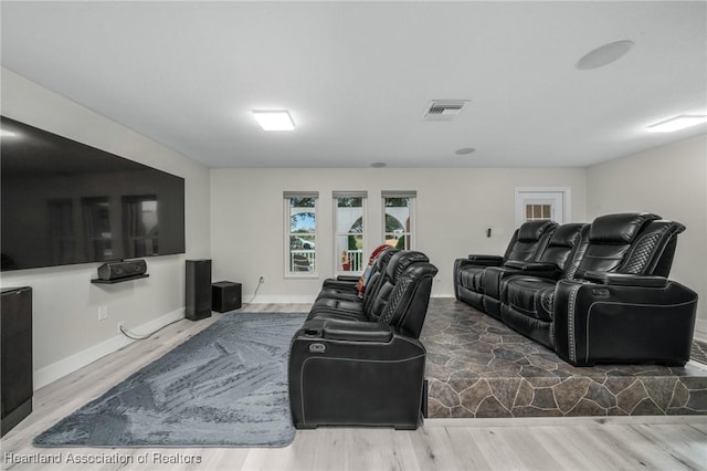 cinema featuring hardwood / wood-style flooring