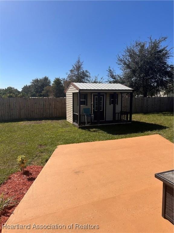 2633 W Newton Rd, Avon Park, FL 33825 - view of patio with an outbuilding and a fenced backyard