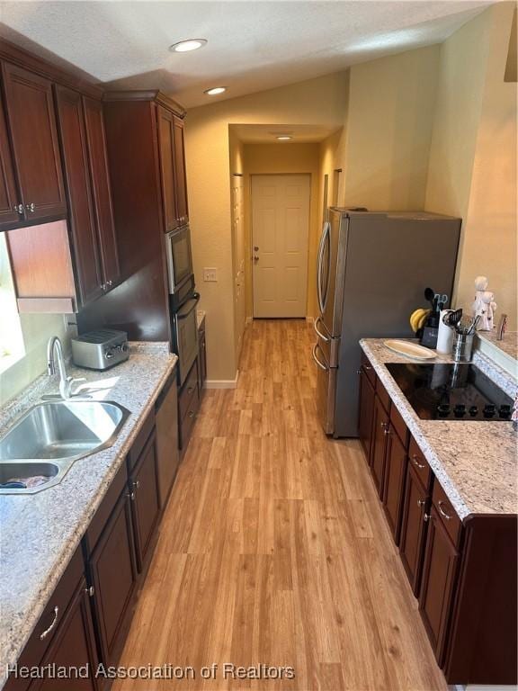 2633 W Newton Rd, Avon Park, FL 33825 - kitchen featuring recessed lighting, light stone counters, black appliances, a sink, and light wood-type flooring