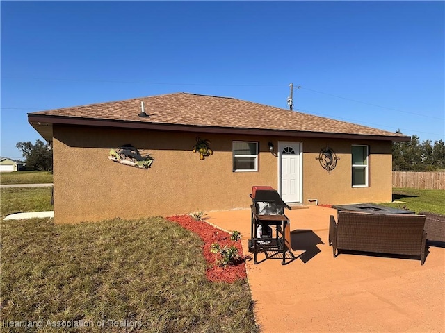 2633 W Newton Rd, Avon Park, FL 33825 - rear view of property with a patio, a lawn, roof with shingles, stucco siding, and fence