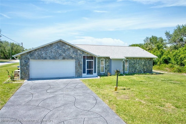 single story home featuring a front yard, stone siding, a garage, and concrete driveway