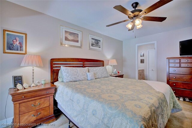 bedroom featuring ensuite bathroom and ceiling fan