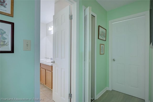 hallway featuring baseboards
