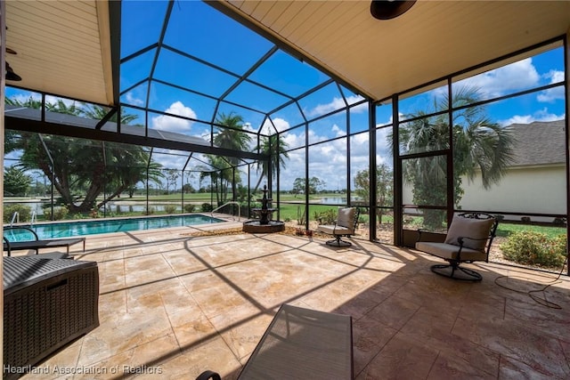 exterior space with a patio and glass enclosure