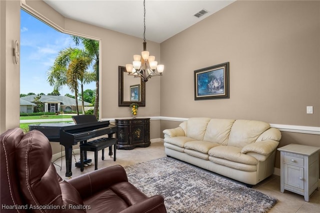 living room featuring light tile patterned flooring, an inviting chandelier, and visible vents