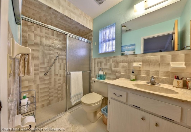 316 Fox Rd, Lake Placid, FL 33852 - bathroom featuring backsplash, vanity, a shower with shower door, and tile walls