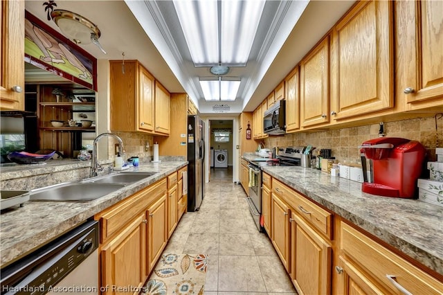 316 Fox Rd, Lake Placid, FL 33852 - kitchen with decorative backsplash, stainless steel appliances, sink, washer and dryer, and light tile patterned flooring