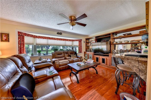 316 Fox Rd, Lake Placid, FL 33852 - living room featuring hardwood / wood-style floors, ceiling fan, ornamental molding, and a textured ceiling