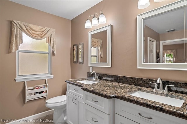 bathroom with vanity and toilet