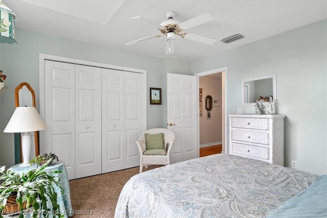 bedroom featuring ceiling fan, a closet, and carpet