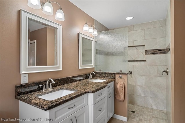 bathroom featuring vanity and a tile shower