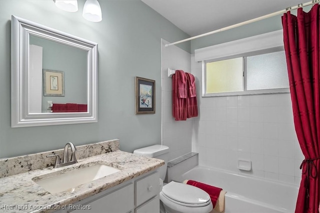 full bathroom with vanity, toilet, and shower / tub combo