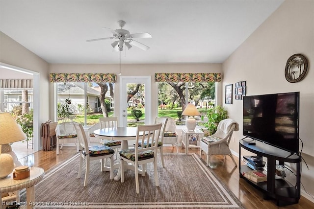 sunroom featuring vaulted ceiling and ceiling fan