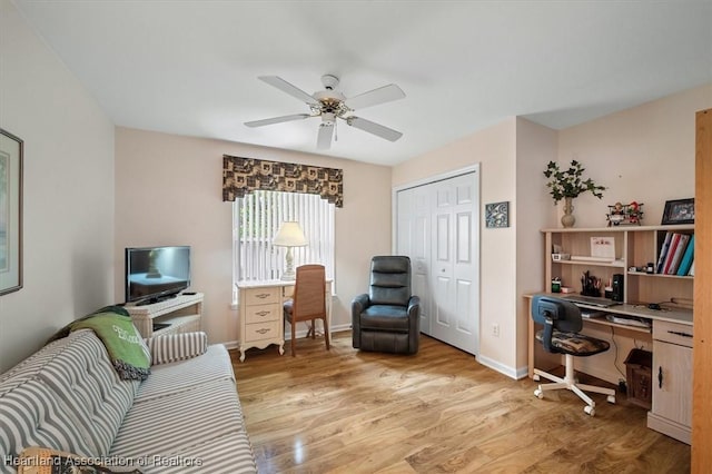 office featuring ceiling fan and light wood-type flooring