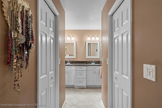 bathroom with vanity and tile patterned floors