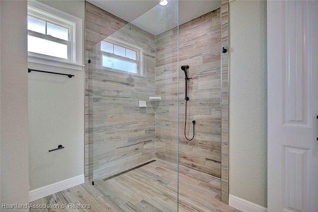 bathroom with a tile shower