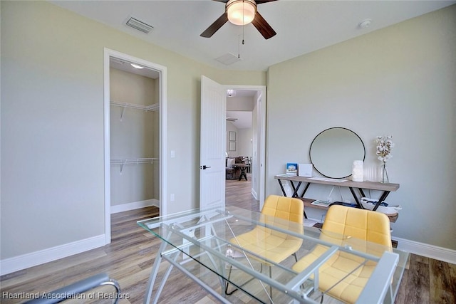 home office featuring ceiling fan and hardwood / wood-style floors