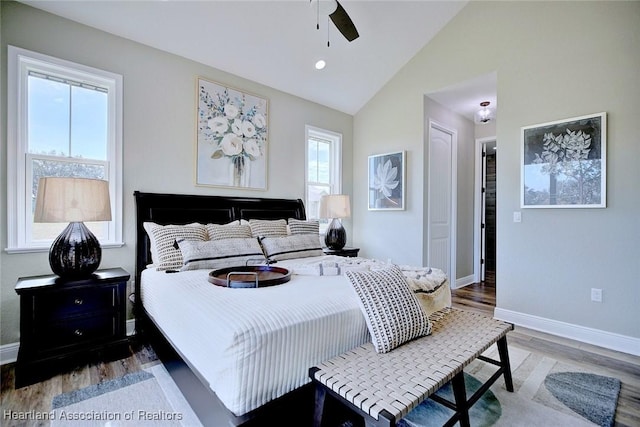 bedroom featuring a closet, ceiling fan, vaulted ceiling, and hardwood / wood-style flooring