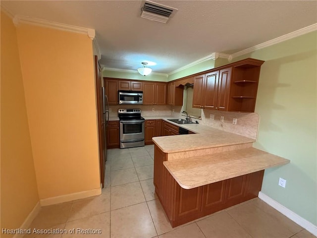 kitchen with sink, decorative backsplash, ornamental molding, appliances with stainless steel finishes, and kitchen peninsula