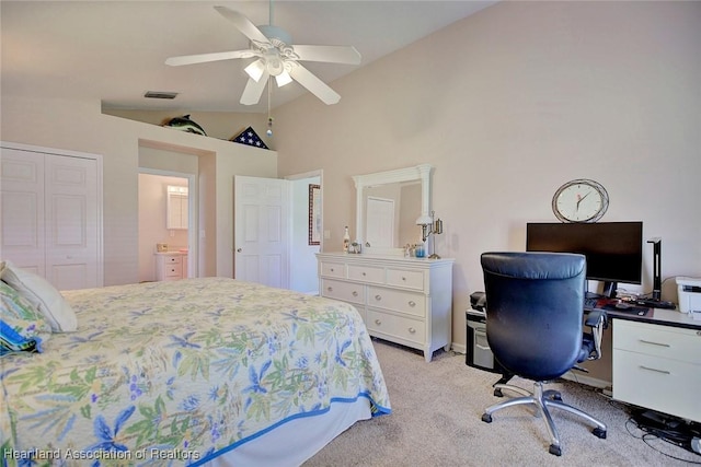 carpeted bedroom with ceiling fan, a closet, and lofted ceiling