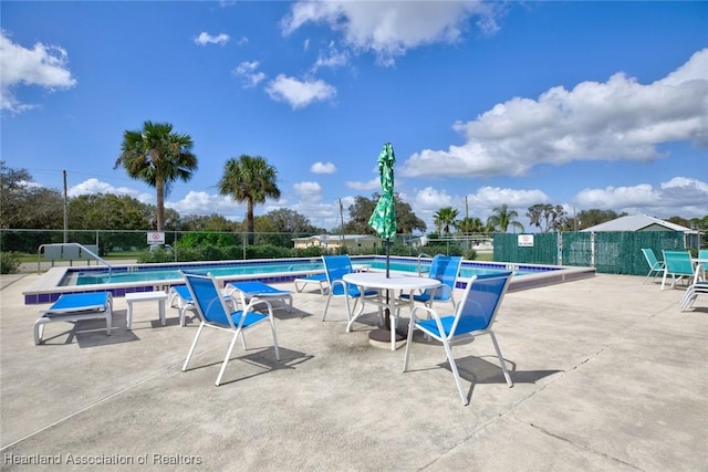 view of swimming pool featuring a patio