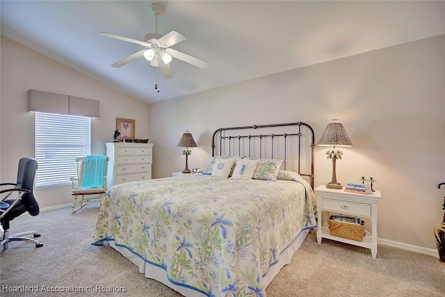 carpeted bedroom with ceiling fan and lofted ceiling