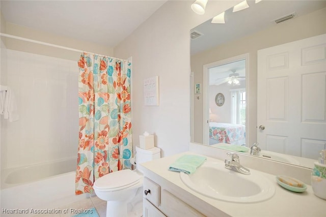 full bathroom with vanity, tile patterned floors, ceiling fan, toilet, and shower / tub combo