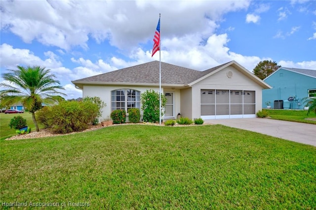 ranch-style home with a garage and a front lawn