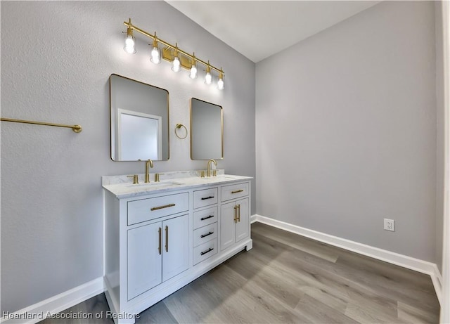 bathroom with vanity and hardwood / wood-style floors