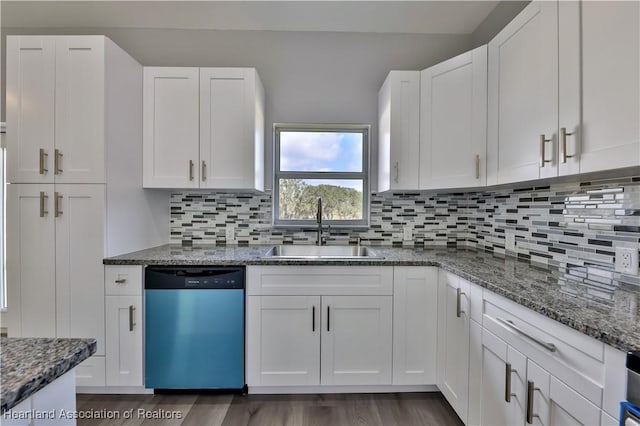 kitchen with sink, white cabinets, and dishwasher