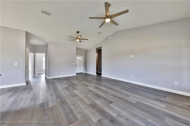 unfurnished living room featuring wood-type flooring, vaulted ceiling, and ceiling fan