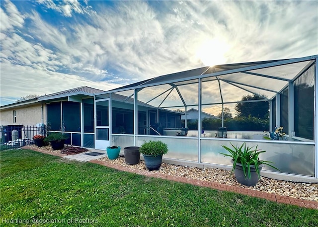 241 Sheppard Rd NW, Lake Placid, FL 33852 - rear view of house with a yard, fence, cooling unit, and glass enclosure