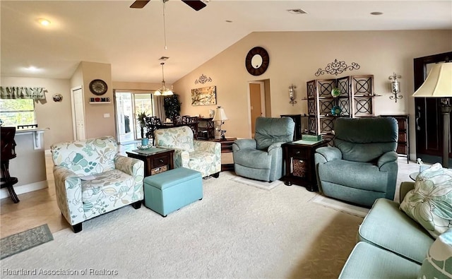 241 Sheppard Rd NW, Lake Placid, FL 33852 - living room with ceiling fan, lofted ceiling, light colored carpet, and a healthy amount of sunlight