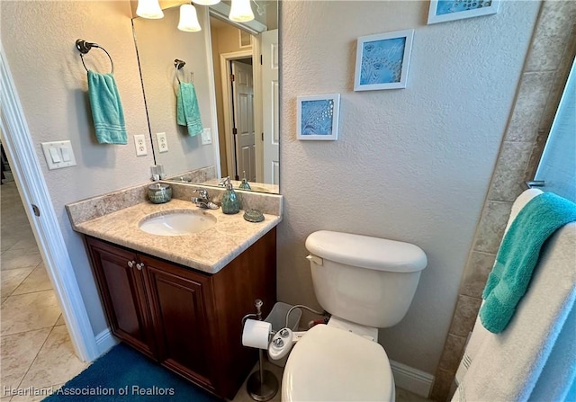 241 Sheppard Rd NW, Lake Placid, FL 33852 - bathroom with vanity, toilet, a textured wall, and tile patterned floors