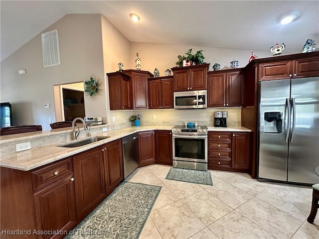 241 Sheppard Rd NW, Lake Placid, FL 33852 - kitchen featuring a peninsula, a sink, visible vents, appliances with stainless steel finishes, and light stone counters