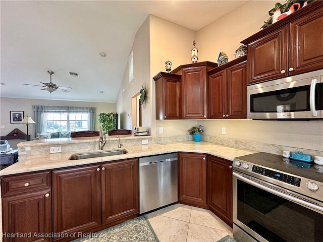 241 Sheppard Rd NW, Lake Placid, FL 33852 - kitchen featuring a peninsula, a sink, visible vents, appliances with stainless steel finishes, and light stone counters