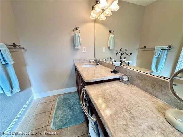 241 Sheppard Rd NW, Lake Placid, FL 33852 - bathroom featuring baseboards, a notable chandelier, tile patterned floors, and vanity
