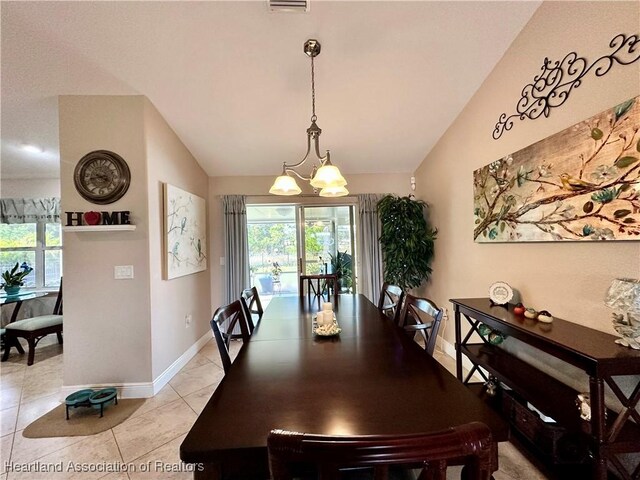 241 Sheppard Rd NW, Lake Placid, FL 33852 - dining area featuring an inviting chandelier, vaulted ceiling, baseboards, and light tile patterned flooring
