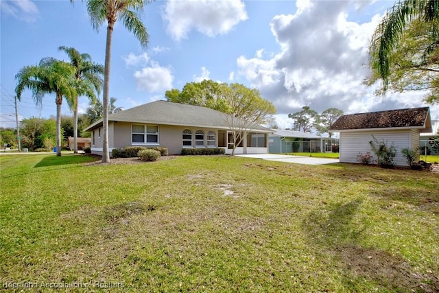 back of property featuring a yard