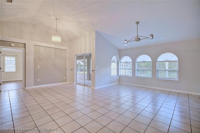 unfurnished room with ceiling fan with notable chandelier, light tile patterned floors, and high vaulted ceiling