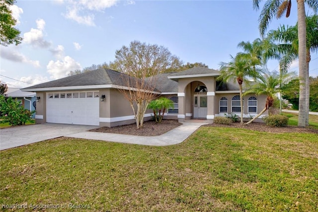 single story home featuring a garage and a front yard