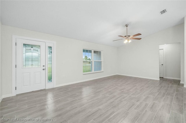 4818 Sturgeon Dr, Sebring, FL 33870 - interior space with visible vents, baseboards, lofted ceiling, ceiling fan, and light wood-type flooring